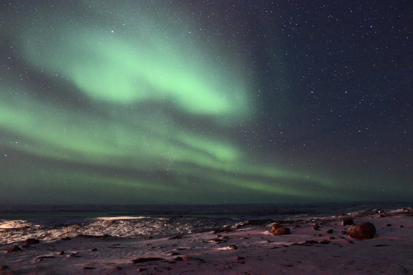 The aurora borealis over the treeless coast at Iqaluit, Baffin Island