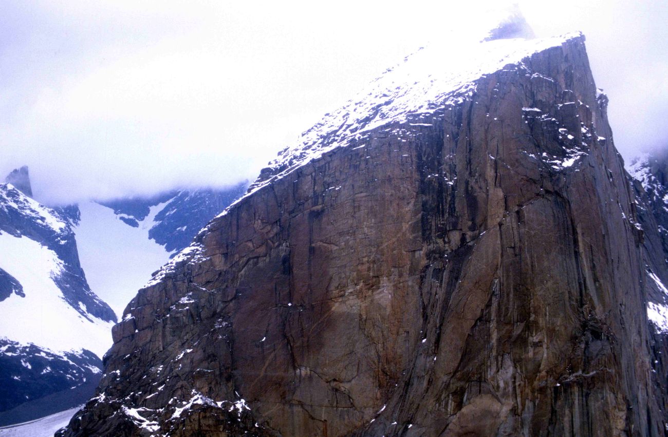 The sheer granite face of Mount Thor above the Weasel River, Auyuittuq National Park